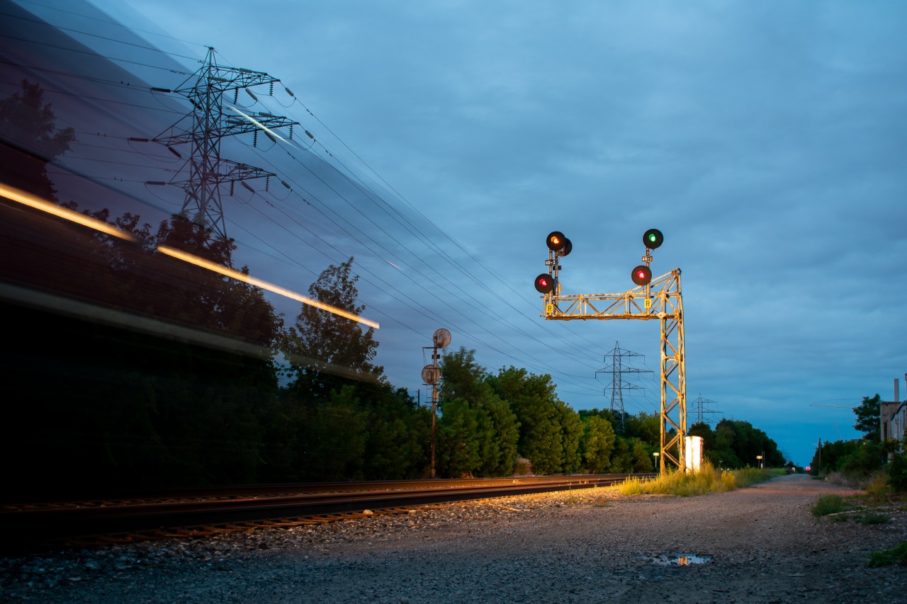 "In Motion" - After a long wait in Lambton, CP 247-28 is about a half second away from knocking down a clear signal on the south track at the pair of intermediates just east of the Bartlett Avenue crossing. As is obvious in this photo, it was getting a little too dark for normal photography, so I brought out the tripod and gave my best at a 2-second long exposure. Aside from the train shaking the ground a bit, I'm proud of how this came out.
