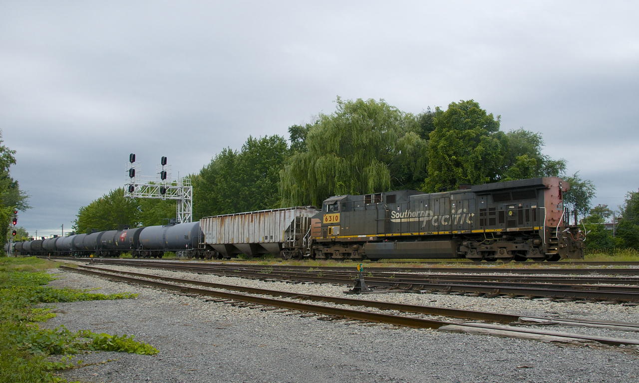 Still wearings its Southern Pacific paint scheme, UP 6310 (originally SP 264, built in 1995) brings up the rear of loaded ethanol train CP 650 as it passes Lasalle Yard.