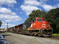 A trio of GE's (CN 3089, CN 3022 & CN 2971) leads CN 120 through St-Henri.