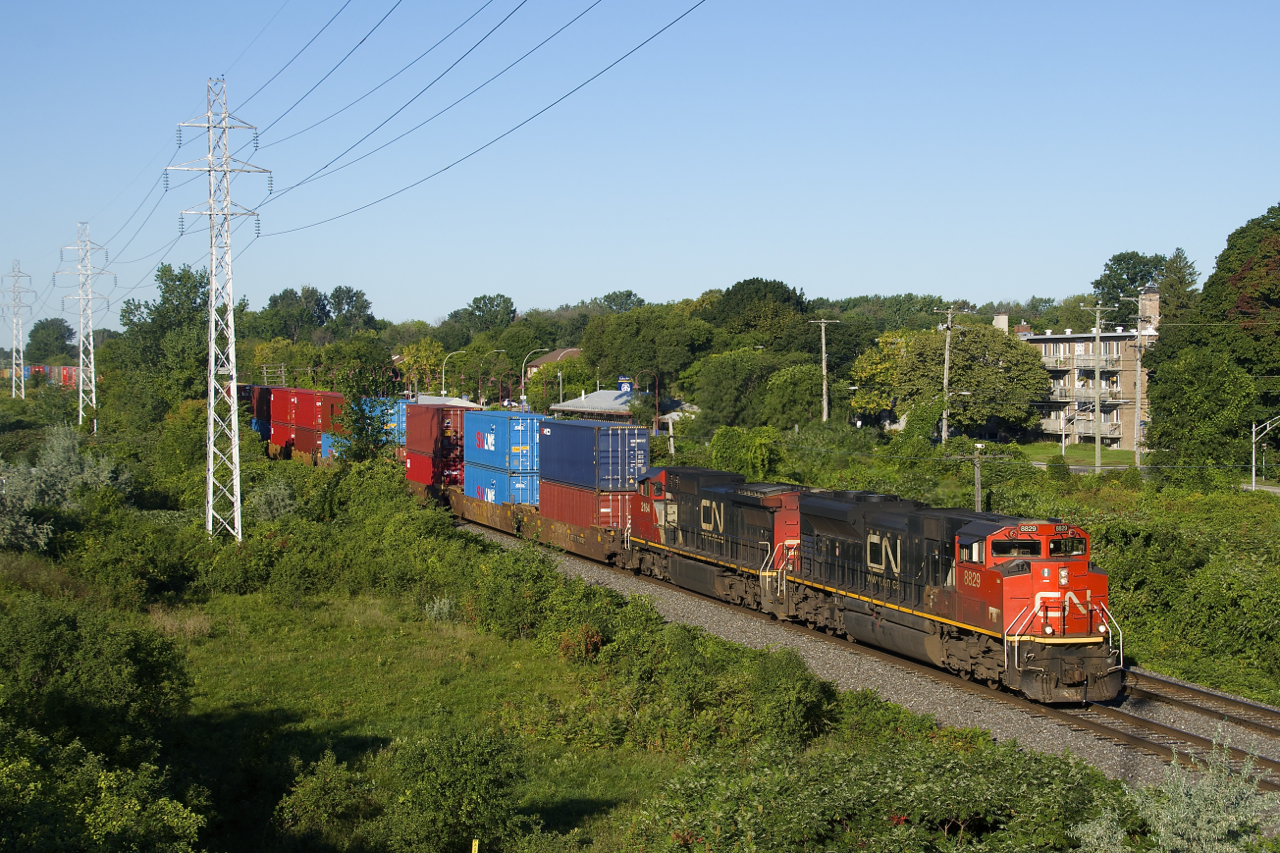 CN 8829 & CN 2164 lead CN X108 through Pointe-Claire.