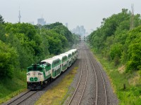 GO F59PH 562 takes the lead of a Lakeshore East train towards Oshawa about to make its first stop at Danforth. Not only is it typically uncommon to see F59s running on the Lakeshore East (although has become more common this year with 6 car trains on all lines) but also is very rare to see them using the class lights. Since the white and green ones basically serve no purpose anymore, the only time you see them on is when the crew is having some fun pretty much, I assume that was the case here :P! To top this shot off, the CN Tower triumphantly stands in the background.