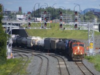 CN X323 has a pair of SD75I's (CN 5710 & CN 5716) as it heads west under a pair of signal gantries near Turcot Ouest. After running as X324 the day before and spending the night in Vermont, the crews run is nearly over.
