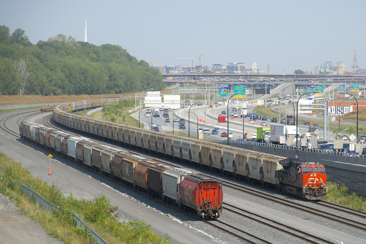 CN 731 has 252 empty potash cars (along with GE's CN 3022 up front and CN 2957 mid-train, for a total of 1,020 axles) as it approaches Turcot Ouest where it will get a new crew.
