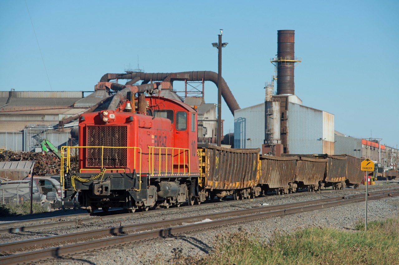 EVRAZ #10 is seen moving a cut of empty mill gons from the furnace back to the scrap yard in the north end of Regina Saskatchewan.