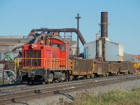EVRAZ #10 is seen moving a cut of empty mill gons from the furnace back to the scrap yard in the north end of Regina Saskatchewan.  