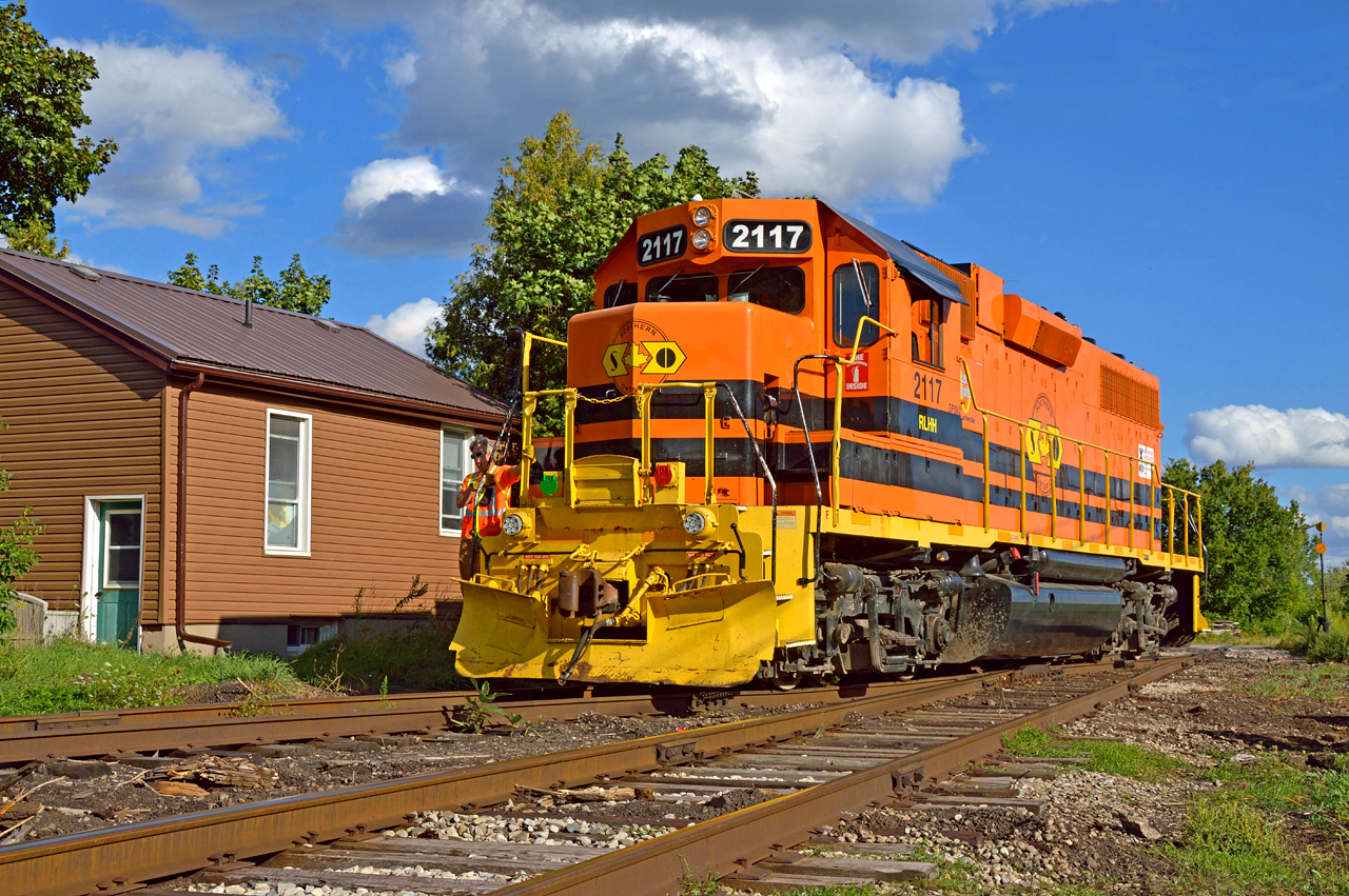 Just your neighbourhood yard job.  Residents of 'The Ward' are used to rolling steel and friendly crews for neighbours.  Trains have passed through, worked in, and been based out of St. Patrick's Ward since the Guelph Junction Railway laid track in 1888, and with OSR moving out last week, GEXR has moved in.  GEXR 583 (ordered 1400) has arrived in Guelph after switching out cars at Arkell and is seen heading around the south leg of the "Downtown wye" (Alice Street wye to some crews) to runaround a cut of cars on the main destined for Lower Yard 2, and the CN interchange tomorrow on GEXR 582 (ordered 0800).  Up until 1976 or so, this area was the base of operations for the CP Guelph yard switcher.  An 0-6-0 switcher during the steam days, and often an MLW S-3 in later years, were based out of the Alice Street engine shed located roughly where the large bush is seen beyond the 2117 above.  After demolition, the yard switcher was based out of a former team track located in the yard downtown.St. Patrick's Ward has always been host to industry and small businesses along with it's residential sector.  The large Italian immigrant community created shops providing anything people could need right in their own back yard; butcher shops and grocers, barber shops, mechanics garages, schools, and Sacred Heart Church.  Numerous industries built factories in the area around 1900 as a number of their workers would come from the Ward.  Some of these included Harding Yarns, Taylor-Forbes Manufacturing Co, (later W.C. Woods), IMICO; the International Malleable Iron Co. (note stock cars behind in siding - today's GJR Lower Yard), and the famed Biltmore Hats.  To the right, out of frame beside 2117 is the former Northern (later Dominion) Rubber Company building, (see this link for view of tracks - 1948) now in the midst of condo redevelopment like much of the former industrial neighbourhood.
