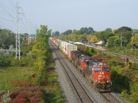 A 522-axle long CN 106 with CN 2886, CN 2573 & CN 2578 is eastbound on CN's Kingston Sub, about five minutes after CN 368 cleared this location.