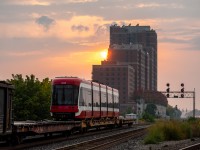 TTC Flexity Outlook streetcar #4413 hitches a ride on the back of train 247 as it departs Lambton for Agincourt. Earlier this day, the streetcar was lifted from TTC Hillcrest by the Lambton Yard engines and was brought to West Toronto to be lifted. After 247 dropped it in Agincourt it was seen the next day on I believe either 118 or 142 headed east on the Belleville Sub. I can only imagine it must've been destined for Bombardier's testing facility out east. 