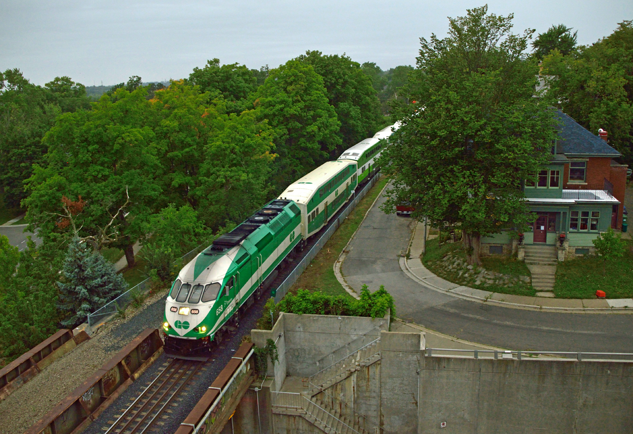 The final eastbound GO train of the morning breaks the silence in Guelph as it slows for it's station stop.
