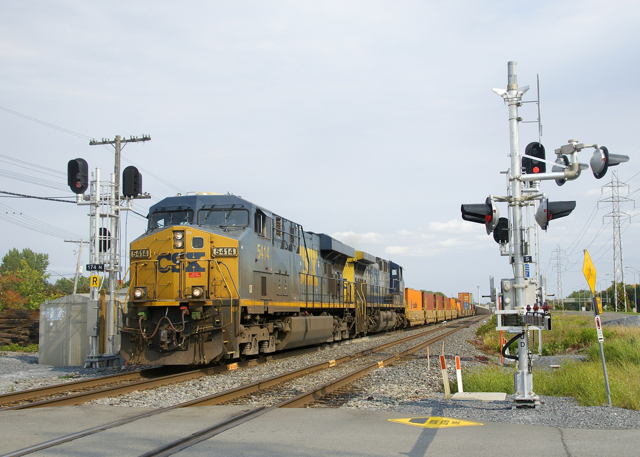 CN 327 with CSXT 5414 & CSXT 451 for power is splitting a pair of intermediate signals at MP 14.7 of CN's Kingson Sub which just entered service during the last couple of weeks.
