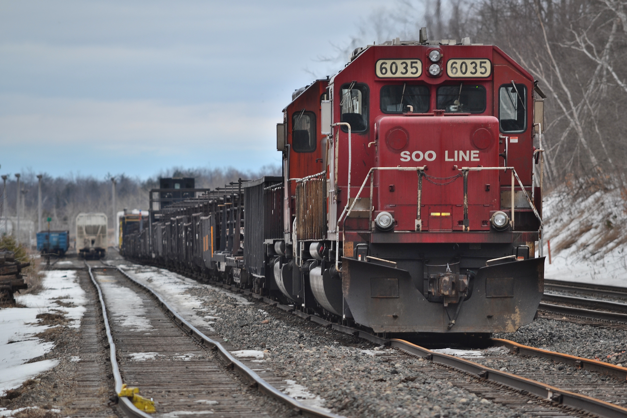 Cooler days ahead! Personally, I am over Summer and counting the days where I can welcome the return of snow. Soo 6035 sits at the West end of GUE waiting to dump track just West of Milton, continuing down to Hamilton later in the day. Does anyone know how far this consist went?