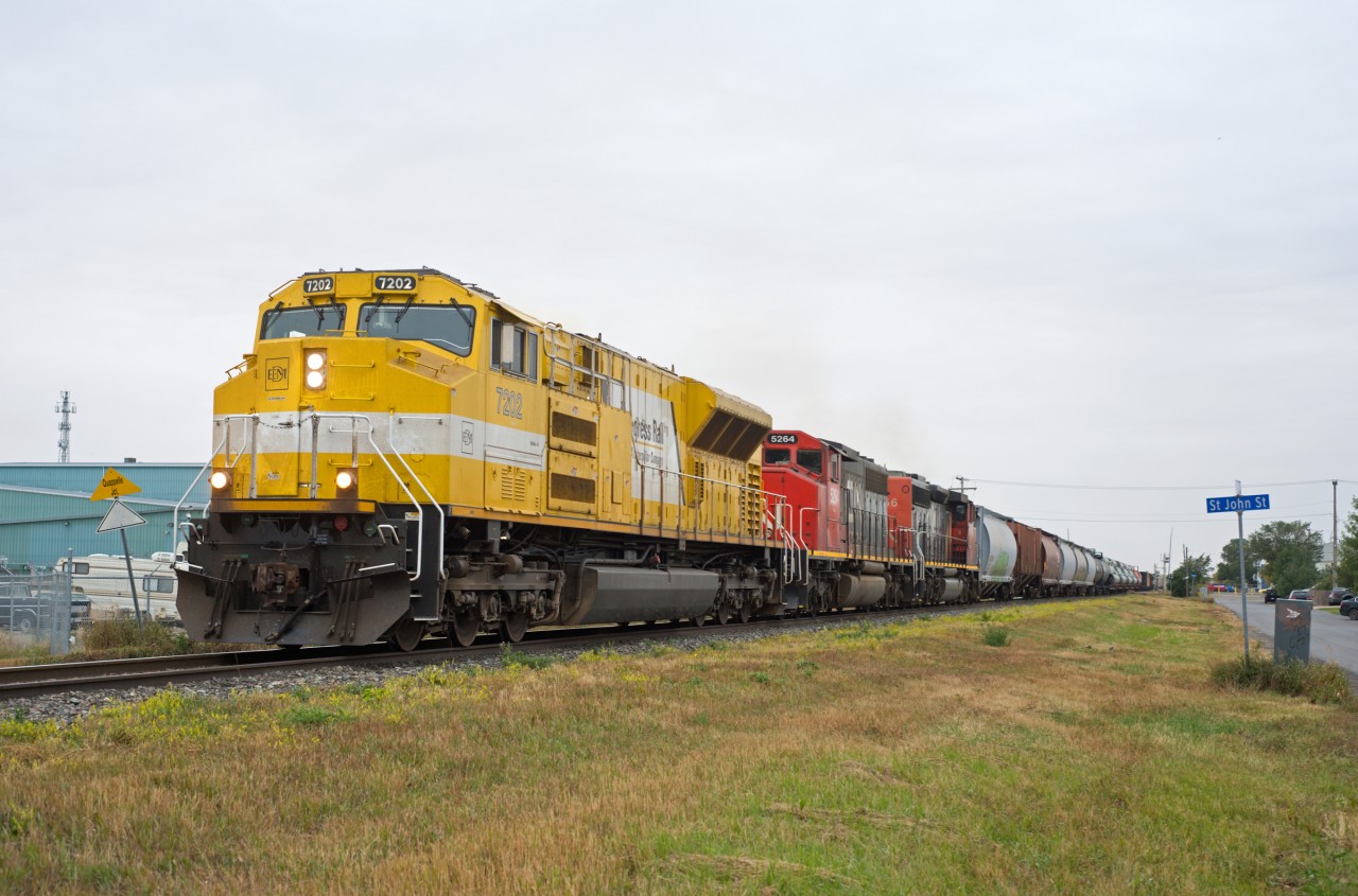 Crummy weather, but too good a consist to turn down.  Regina-Melville A423 is seen departing Quappelle Jct with EMDX 7202, CN 5264, and CN 5356 up front and CN 2955,3908 buried mid train.