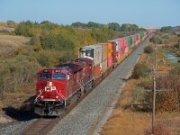 CP hotshot flagship train 101 is seen making great time just east of Mortlach SK on a pleasant fall day. 