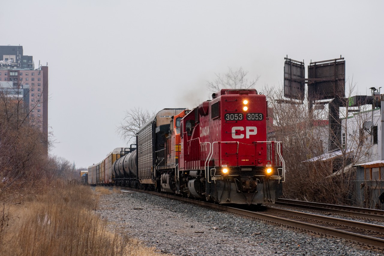 CP 3053 is long-hood-forward as it takes the lead of 244 through mile 4.6 of the North Toronto Sub. As is the case with many 244s, the leader into Windsor was the solo BNSF dash 9. A lot of the times any sort of CP leader will be shoved on if available, and in this case 3053 was a viable candidate, only problem was it was facing the wrong way. I guess nobody had time to wye it anywhere, but at least it has the precious hot-plate!
