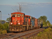CN 1444 leads the charge East with two GMD1's and GATX trailing. The sun came out at just the right moment after being overcast for a solid two hours. Surprising, looking at 1444's frame and comparing it to the other GMD1, something isn't looking right.