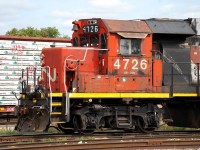 We've all seen our fair share of quick-fix replacement number boards; some are done quite well while others leave a lot to be desired. The classic cardboard and duct tape type come to mind.  CN 4726 has a pretty ugly replacement number board on the conductor's side.  It hasn't inspired me to go out of my way to photograph it until yesterday when I heard 580 blowing for Stanley Street when leaving work.  Upon reviewing those photos I noticed something interesting about that replacement number board.  The "6" looks like the font CP uses on their number boards.  Zooming in on the photo you can see the weird looking "4" was clearly made from a "1", and there's a faded "8" where the "7" is painted.  1800's were CP RS18u's.  So how did a CP RS18u number board end up on a CN GP38-2?  Then I recalled seeing a former New Brunswick East Coast Railway RS18u heading to Woodcrest (IL) for disposition after CN had reacquired the NBEC.  Looking closer at the number board, it looks like "1838" behind the crude "4726".  Sure enough NBEC 1838 was one of the RS18u's that went to Woodcrest and was scrapped!  So a little piece of a CP RS18u lives on.  Now that ugly looking number board is pretty interesting!  And if you're wondering why Woodcrest didn't just make a proper number board (assuming 4726 got the number board there), that's a good question!      