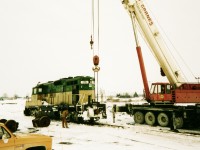 Goderich-Exeter Railway (GEXR) GP9 179 undergoes some emergency traction motor repairs near the location of the CN roundhouse at Stratford Yard.
<br>
The winter of 1993-1994 was a brutal one for GEXR's fleet of second-hand GP9’s and by early February, most were either out of service or severely ailing, which forced RailTex to lease power or transfer from their other operations.