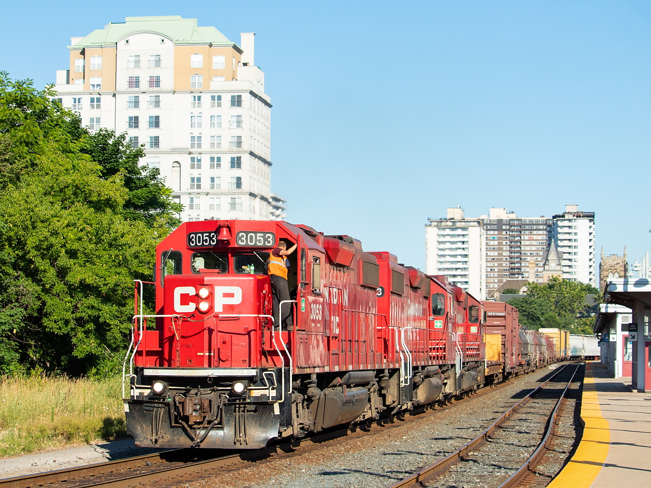 TH21 was a train I pursued on quite a few occasions in the early morning this past summer. Being on duty in Kinnear at 2300, the crew had until 0900 the following morning before they were out of hours. TH21 typically drills Aberdeen, shoves 142 up the hill, and makes the odd appearance down the Belt. Getting them coming back from Aberdeen was my white whale this summer, and there was a fine line to walk in which to do so and many stars needed to align: 1) They had to still be there after sunrise which more often than not was not the case; 2) They had to let the sun come up high enough to avoid shadows; 3) For this specific location, they had to be nearing the end of their hours, but not so late that the GO Station platform doors were locked (which they are outside of typical GO hours); etc. Anyways, you can see where I am going with this - a lot of things had to work out to get a shot of them in the morning. With TH21 now on duty at 1800, their hours run out at 0400 meaning for the time being (aka until/if the schedule changes again), there is no more early morning shot coming home from Aberdeen. There were other shots I attempted this summer but was unsuccessful due to the multitude of things that had to go right, and in the end, this was the best I managed.