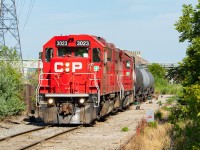 Nothing too exceptional about this photo - it's a scene that plays out many times each week. CP TH11 is up in Hamilton's north end, switching out their cars in Adams Yard. I share it to pick up on a conversation in the <a href="http://www.railpictures.ca/?attachment_id=42655" target="_blank">comments of this shot</a>, where I wanted to show the red flag on the east leg of a wye. One noteworthy thing to point out here is the power for the day is only two units, which is a rarity around here as CP almost exclusively runs with three in Hamilton. 3055 had crapped out the previous day, and 3130 was on its way to replace it on that day's 246. So for this day, 3023 and 3053 carried out the duties for CP.