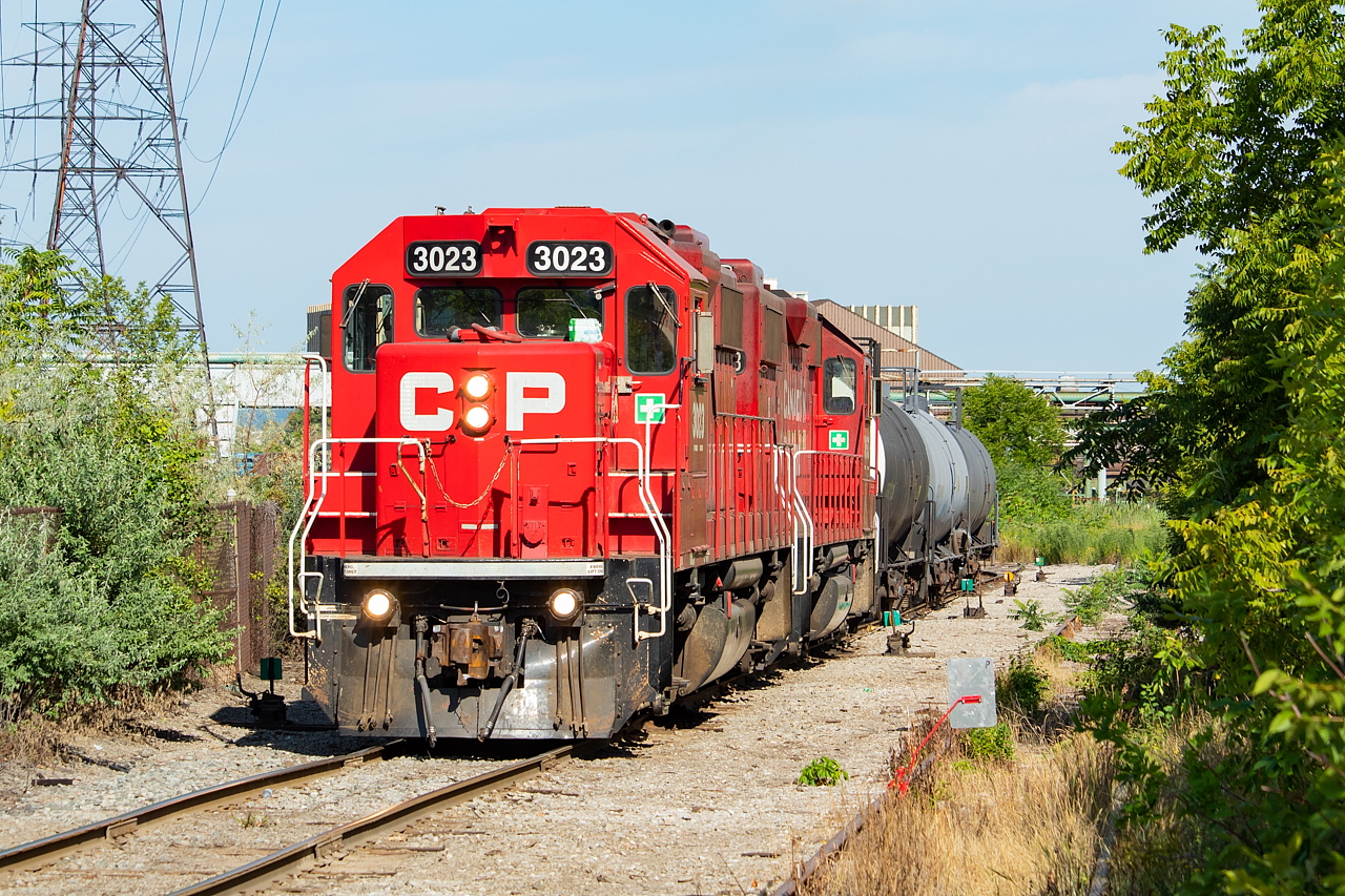 Nothing too exceptional about this photo - it's a scene that plays out many times each week. CP TH11 is up in Hamilton's north end, switching out their cars in Adams Yard. I share it to pick up on a conversation in the comments of this shot, where I wanted to show the red flag on the east leg of a wye. One noteworthy thing to point out here is the power for the day is only two units, which is a rarity around here as CP almost exclusively runs with three in Hamilton. 3055 had crapped out the previous day, and 3130 was on its way to replace it on that day's 246. So for this day, 3023 and 3053 carried out the duties for CP.