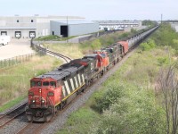 It is unfortunate that these unit tank trains that ran over CN were somewhat short lived. It wasn't unusual for them to have interesting lash ups and even foreign power, quite often BNSF units. This day a pair of Dash-8's lead an ES44 and an IC SD70 as the train rolls eastward past local 551 at the highway 401 overpass in Milton.