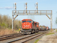 The three railways of Duff, Part 1: CN. Since it is CN track, I will start with them. For a few months in the Spring, 531 was cancelled and 562 was doing the transfer duties normally handled by 531 (NS cars in Fort Erie, stacks delivered to CSX in Buffalo, and manifest for the BPRR). They were typically going across the border earlier than 531 normally would, and thus were coming back (as 561) much earlier than 530 normally does which meant an opportunity to shoot them. Here, they’re backing onto cars left earlier in the evening for them by C93 (which was led by NS 3344). <br><br>The coils visible in the shot were in storage at the time. Next up is <a href="http://www.railpictures.ca/?attachment_id=42809" target="_blank"> CP (link here)</a>, then <a href="http://www.railpictures.ca/?attachment_id=42810" target="_blank"> NS (link here)</a>.