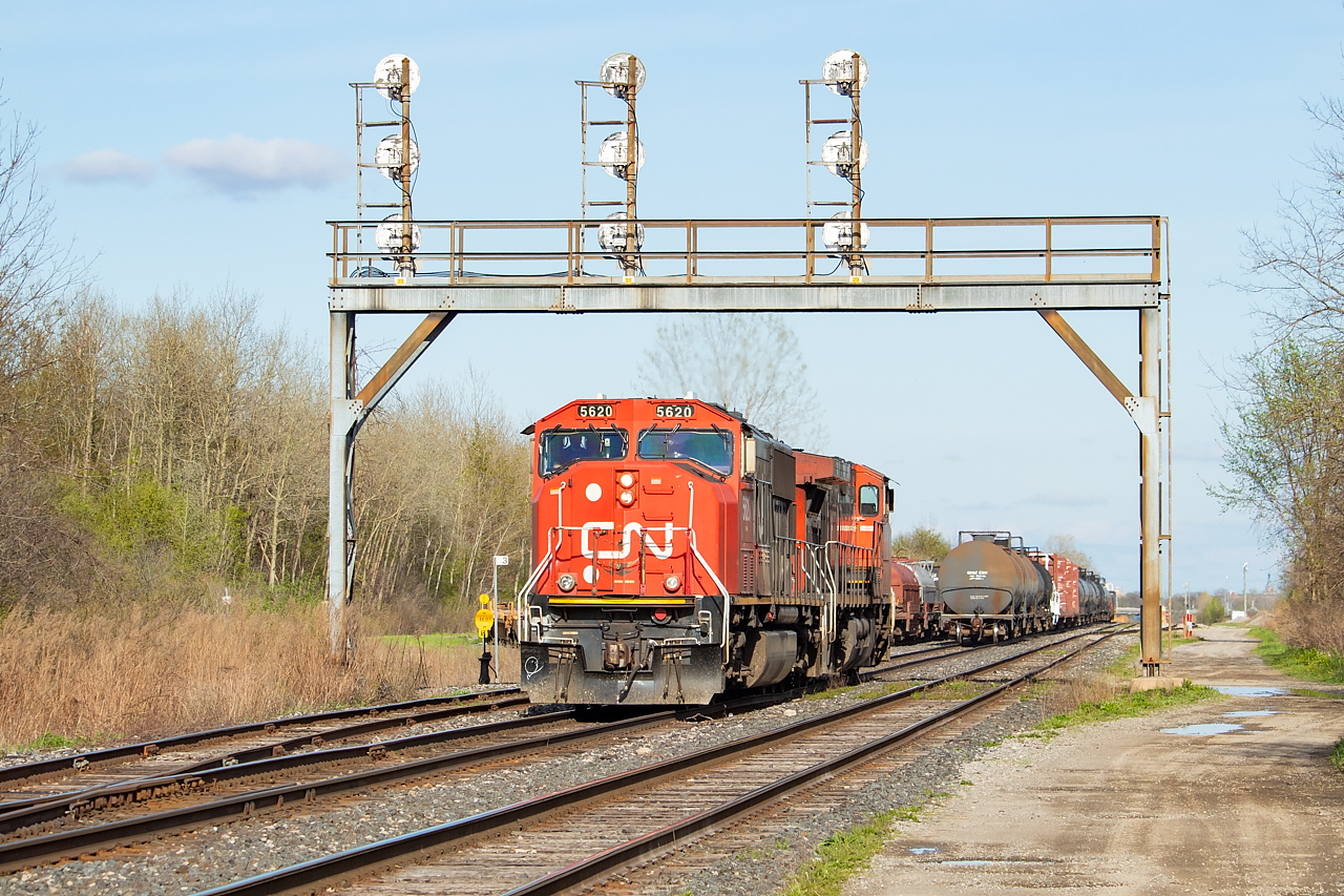 The three railways of Duff, Part 1: CN. Since it is CN track, I will start with them. For a few months in the Spring, 531 was cancelled and 562 was doing the transfer duties normally handled by 531 (NS cars in Fort Erie, stacks delivered to CSX in Buffalo, and manifest for the BPRR). They were typically going across the border earlier than 531 normally would, and thus were coming back (as 561) much earlier than 530 normally does which meant an opportunity to shoot them. Here, they’re backing onto cars left earlier in the evening for them by C93 (which was led by NS 3344). The coils visible in the shot were in storage at the time. Next up is  CP (link here), then  NS (link here).