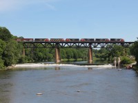 CN M394 heads east over the Grand River in Paris, ON with a trio of retired cowls DIT. 

(BCOL 4621 (C40-8M), CN 2406 (C40-8M), & BCOL 4615 (C40-8M)) 