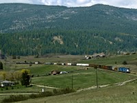 Eastbound Kelowna Pacific(a CN spinoff) Kmloops to Vernon BC freight rolls through the Grandview Valley west of Armstrong. The line was repossessed by CN a year later and the Vernon to Kelowna section was abandoned. Omnitrax's  Okanagan Valley railway (a CP Spin Off from Sicamous to Kelowna sharing the track south of Armstrong) exited operations a year earlier. Kelowna, largest city in BC's interior is now without ra1l service, but industrial Parks in the Vernon area keep the line busy for CN 