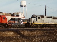 PNC 3011 and HATX 511 as well as several CP units await their next assignment at CP's Toronto Yard diesel facility. This was during the great CP lease fleet era of the mid-1990's when the railway was leasing hundreds of unit's from various companies. 