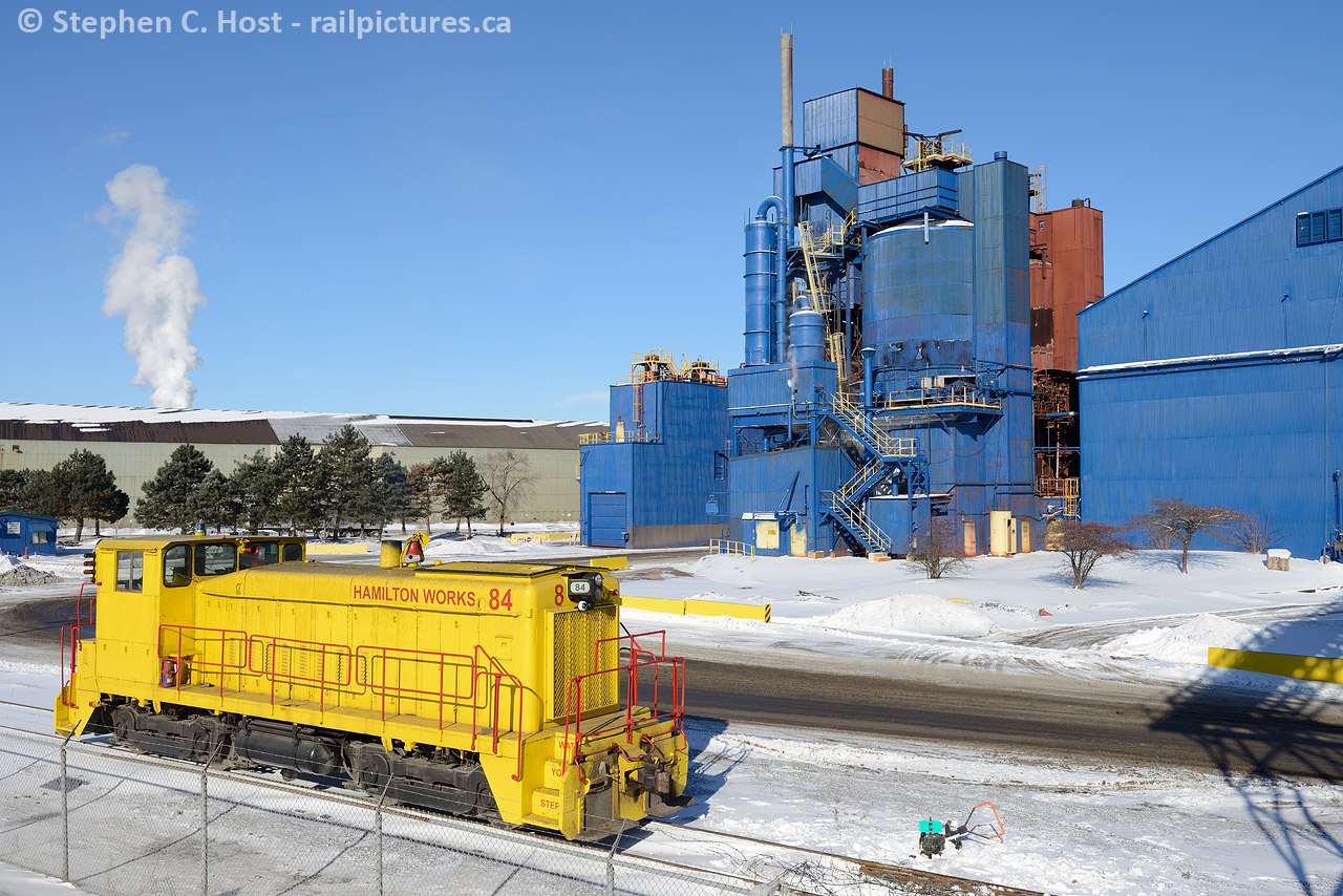 With thanks to friend Jay Brooks, he noted that Stelco 84 was parked at the foot of Gage Ave for reasons unknown. Of course, I took the afternoon to come down and photograph it, this was a rare opportunity then as it is now. Plenty of time to compose on this very cold winter's day. What I enjoy is the fresh snow that hides the usual steel mill grit and grime that adds browns to just about everything.
Here's a Bill Thomson photo of #84  being delivered in 1959. It's still there, but Stelco has switched to Trackmobiles.