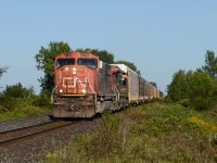 CN train E275 pulling down into Sarnia, after being stopped outside of town, while they made some room. CN 5756 and CN 2146, pulled a train of 2/3 autos racks, both loads and empties, and 1/3 of mix freight, which was lots of Bulk loads of lumber and truck frame on flat cars.