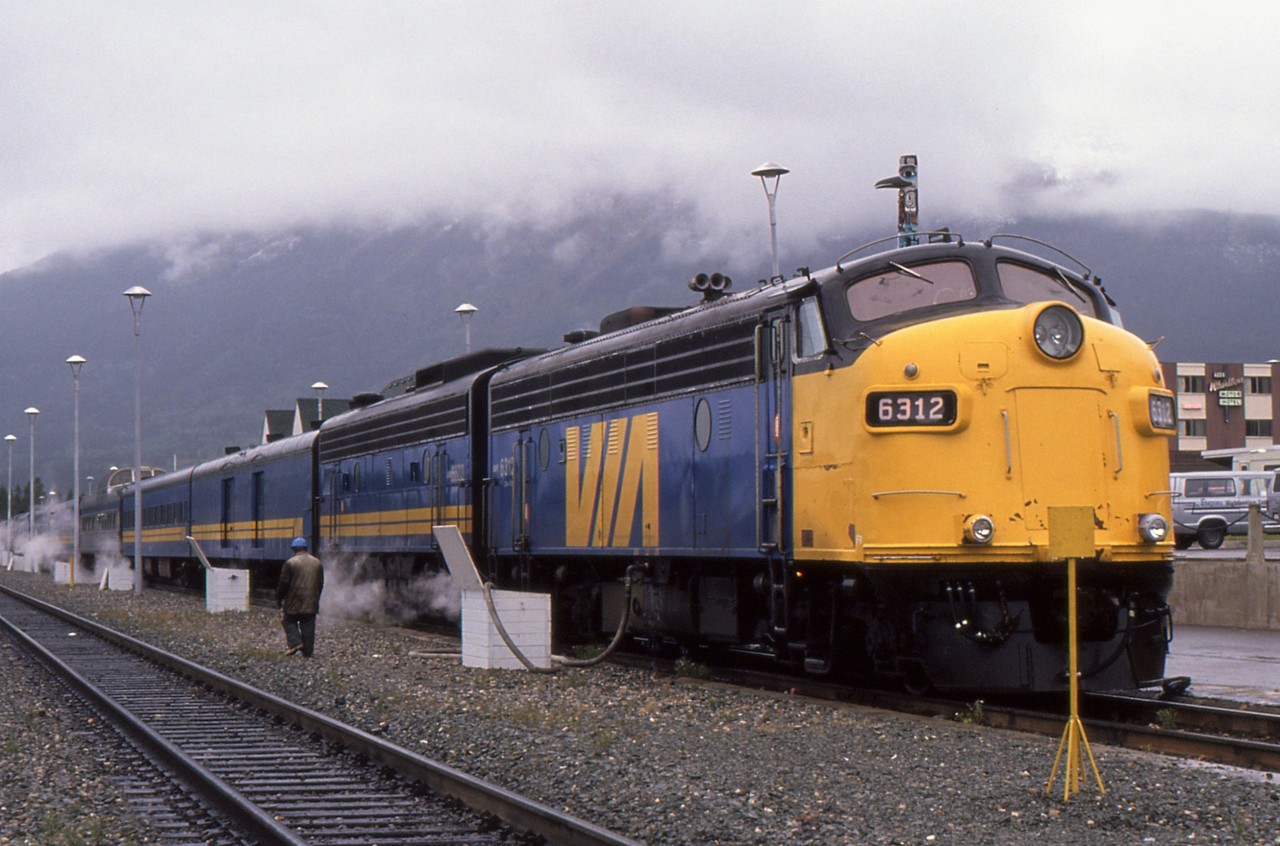 SUPER CONTINENTAL STATION STOP - During its 40 minute station stop at Jasper, the eastbound Super Continental # 4 gets a full servicing and crew change while the photographer and his fiancée quickly explore this beautiful gem in the Rockies. Now on the return trip to their native Newfoundland, they chose the 2 night northern route back to Winnipeg to connect with the eastbound Canadian # 2 for the run into Toronto for a few days.