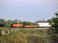 CN 79291 makes a beautiful end to a freight in Pickering, Ontario on October 12, 1986.
