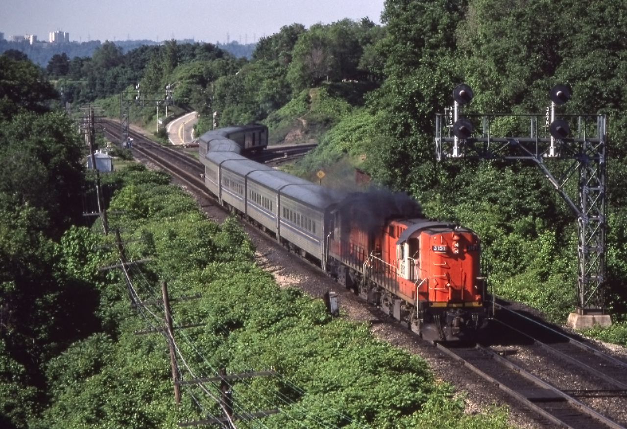 CN 3151 leads an eastbound VIA train through Bayview Junction, Ontario on June 21, 1980.