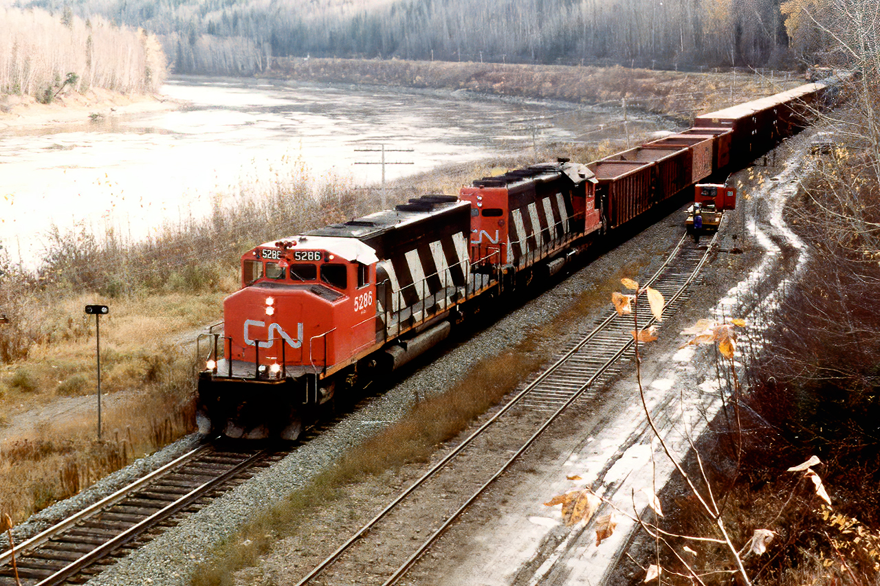 A very short westbound is almost home in Prince George behind an SD40-2W, SD40 lashup. 

I only worked in Prince George for a few weeks before traffic died and I was shipped off to Edson( laid off loaner from Ontario sent west just as traffic collapsed. I'm standing just by the BC Rail bridge over the Fraser River in a place that would be great to explore; even if BC Rail is sadly just a memory.