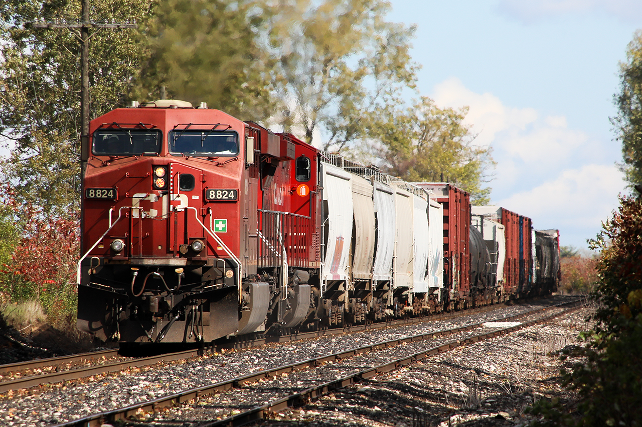 Physics...when you tack 50 cars of freight onto another 100+ of ethanol empties, and ask them to charge up a hill into a 30 mph wind...well, things are going to get interesting. At one point, down to 2.3 mph on the climb, 651 is just starting to find its legs again as it begins accelerating towards London. GE 1, gravity zero.