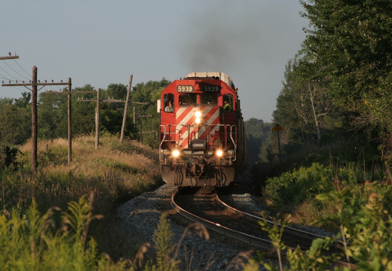 CP 5939 leads a westbound autorack train as it storms towards the level crossings of Drumbo, ON in August 2011.