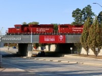 With all the electronic signs going up on CP bridges in Mississauga It makes it easy for CP to get some advertising in. I have seen a few CP advertisements on them but luck has to be on your side to get it to work out with a train decently positioned above. Luckily Streetsville yard offers a few opportunities thanks to switching moves by T14. Here the local is seen busy working the yard as it crosses Britannia Road. 
