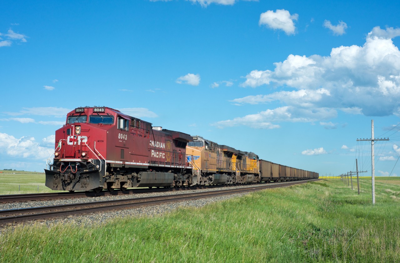 CP K51 rolls through Boharm Saskatchewan with a couple Foreign visitors tucked in behind.