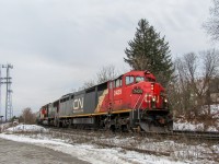 CN 303 travels north coming around the bend at Gormley ON, and is greeting with a clear on the approach to Quaker, and a very happy railfan. CN 2429 (C40-8M), CN 5611 (SD70I) make up the power for this train.
This was actually the first ever train I shot with my current camera, and this specific consist isn't catchable today, as CN 2429 is one of many C40-8M "Cowls" that have been sold for scrap. While that news, when it first broke out, was very sad, at least I have this tangible memory of 2429 riding the rails one last time. 