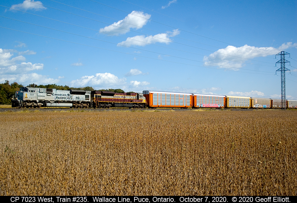 Fall is here and the colors are showing all around.  Even on the trains.  CP Military Tribute unit #7023 leads CP Script heritage unit #7013 on train #235 as it rolls through the Essex County country side near Puce, Ontario on October 7, 2020.