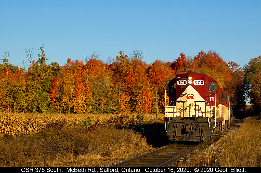 Hard to beat Fall colors and early morning sun.  Ontario Southland GP7 #378 leads the St. Thomas job south out of Salford, Ontario and through a beautiful Fall color setting with a lone tankcar bound for the transloading facility in Tillsonburg.