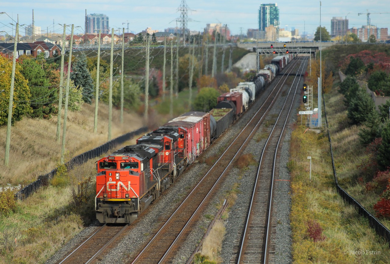 CN 395 passes under the Bovaird Drive West overpass while it climbs a grade approaching Norval.