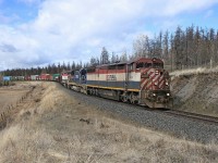 A very dry spring day, not much colour except for the trio of BC Rail units leading train 571. We had been out chasing couple of trains and this was the last spot for photos that day.