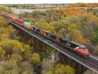 CN 147 crosses the Fairchild Creek Bridge with a trio of GE products providing the power for this long intermodal for Chicago.  