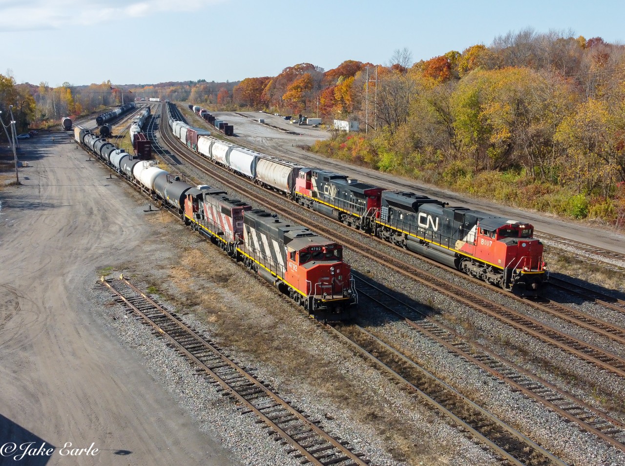 As L532 (seen to the left) does their switching before calling it a day, M376 (seen to the right) is seen passing them through the Brockville yard on a surprisingly sunny and warm Friday.