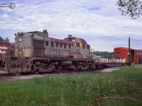 CPR RS3 8459 rests at Orangeville with a cut of cars on a summer day. Built by MLW in 1954, this locomotive would serve it's entire career in the tattered script scheme, retired on October 3, 1979, and scrapped at Angus Shops.<br><br>Arnold Mooney shot 8459 around Woodstock in June, 1979, just months before retirement:<br>Departing the "shop track" at Woodstock: <a href=http://www.railpictures.ca/?attachment_id=39641>June 12, 1979.</a><br>Northbound near Mount Elgin, returning from Tilsonburg: <a href=http://www.railpictures.ca/?attachment_id=6301>June 12, 1979.</a><br>Working the west end of Woodstock: <a href=http://www.railpictures.ca/?attachment_id=15054>June 16, 1979.</a>