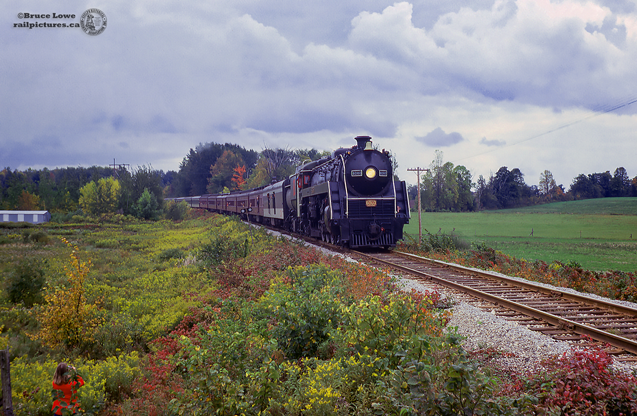 CNR U-1-f "Bullet Nose Betty" 6060 is seen on the point of an excursion run by the NRHS Buffalo Chapter at Whitelaw Road near Guelph; mile 28 of the Fergus Sub.  The train would begin it's reverse move shortly to make a runpast at the crossing.  Afterwards the train would continue to Guelph and turn on the wye to face westbound.  Bill Thomson would shoot the train in Guelph.