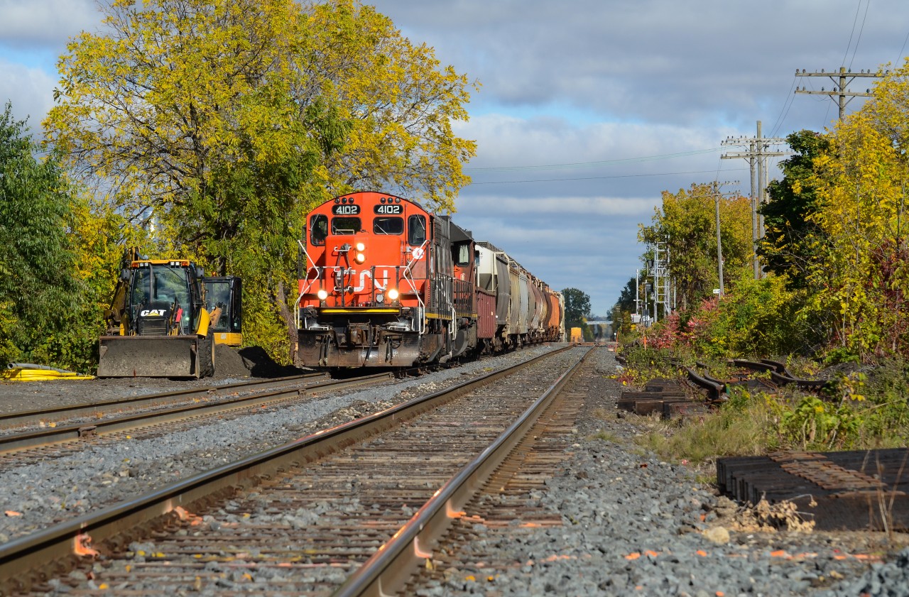 With its original post rebuild number boards, CN 4102 paired with 4725 switches out the west end of Kitchener as 568 setting up cars to go down the Huron Park Spur for Ampacet and CP. The new signal set on the right (another on the left blocked by 568) guards the new crossover that’ll be put between Lancaster and St Leger Streets that will be used by GO when needed and also to prevent west bound movements to the Huron Park Spur from pulling all the way to the single track at Kitchener West, shoving back to the switch then pulling down the Huron Park as there is no crossover from north to south between Kitchener West and the yard. The crossover is now in place at the moment, but I don’t think it’s in service yet. This is 4102’s first run at Kitchener since the CN takeover 2 years ago and it is the gloomiest time of the year unfortunately so getting anything in perfect sun this time of the year is decently tricky. If I recall correctly, there hasn’t been more than 5 perfectly sunny days since this shot so I was pleased with the result including the threatening sky in the background from the last night’s rain. As I type this though, Mr Sun is trying to tell me something as it just came out of the clouds...